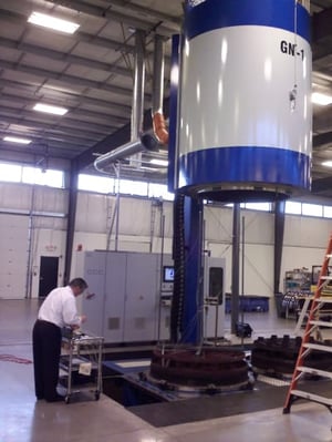 Man testing an industrial furnace and controls for accuracy